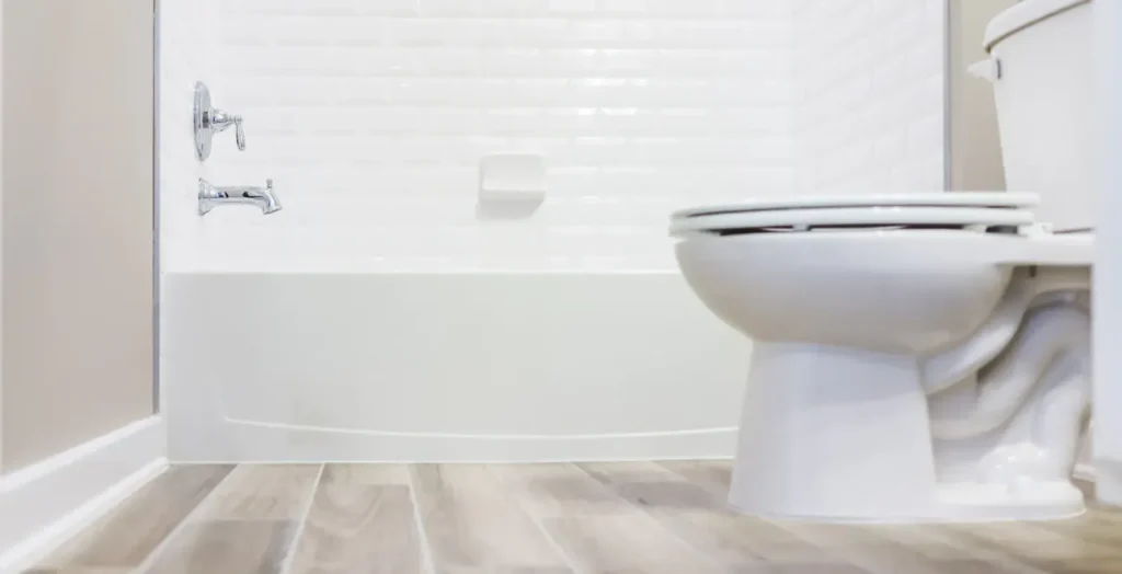 sewage backup in bathroom with contaminated water on floor